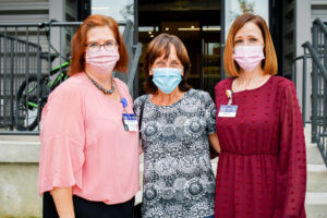 On a visit to The Wright Center for Community Health, MaryEllen Warnero, center, received support from employees involved in its Alzheimer's and Dementia Care Program, including, at left, Sharon Wittenbreder, C.R.N.P., a certified registered nurse practitioner, and Nicole Lipinski, R.N., C.D.P., director of The Wright Center's Geriatric Service Line.