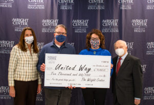 Participating in the ceremonial check presentation ceremony at The Wright Center, from left, are Deborah Kolsovsky, chairperson, United Way of Lackawanna and Wayne Counties’ annual campaign; Gary W. Drapek, president and CEO, United Way of Lackawanna and Wayne Counties; Dr. Linda Thomas-Hemak, president and CEO, The Wright Centers for Community Health and Graduate Medical Education, and Gerard Geoffroy, chairperson, The Wright Center for Community Health Board of Directors.