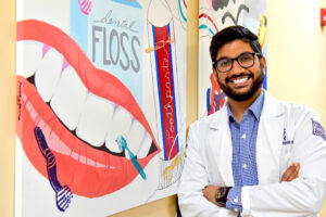Dr. Satya Upadhyayula posing for photo at dental clinic