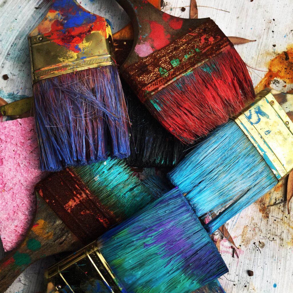 Image of used and colorful paint brushes