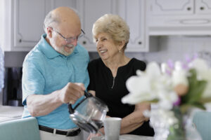 Image of Andy and Agnes Touch in their kitchen making coffee