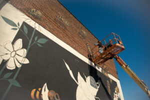 Photo of honey bee-themed mural, painted in downtown Scranton as part of artist Matthew Willey’s global “The Good of the Hive” initiative