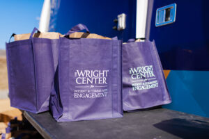 The Wright Center for Patient and community engagement tote bags on table