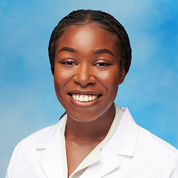 Headshot of Dr. Ashley Okuagu on a blue background