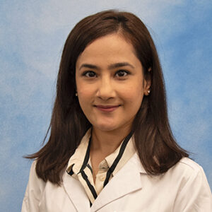 Maryam's headshot with blue background and long dark hair