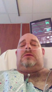 patient in hospital bed with oxygen