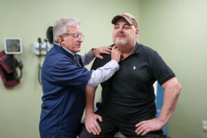 Dr. Dempsey with patient Dan Schultz getting check up