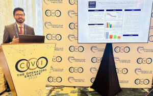 Resident Tabassum presenting behind podium