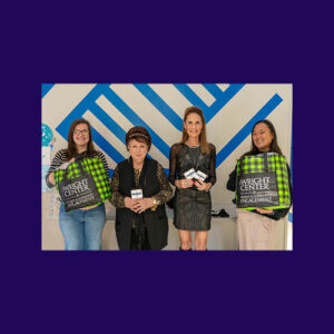Boys and Girls Club Bombas Donation holding the socks