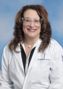 Dr. Linda Thomas-Hemak's portrait with white coat and glasses