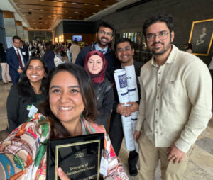 Resident physicians who presented and competed at the PA-ACP Eastern Region Doctor's Dilemma and Poster Competition in Scranton, Pennsylvania, in October 2025 are smiling in a group holding their posters