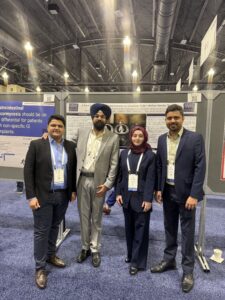 residents standing in line in suits posing in front of their scholarly poster