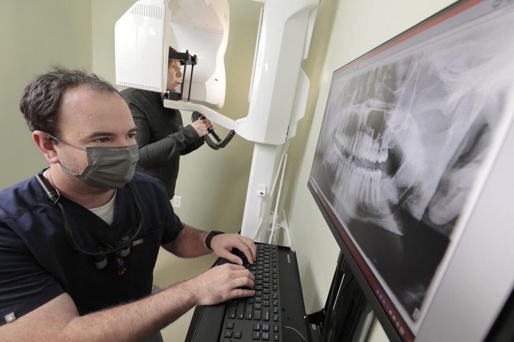 Dr. Michael Regan demonstrating the X ray machine