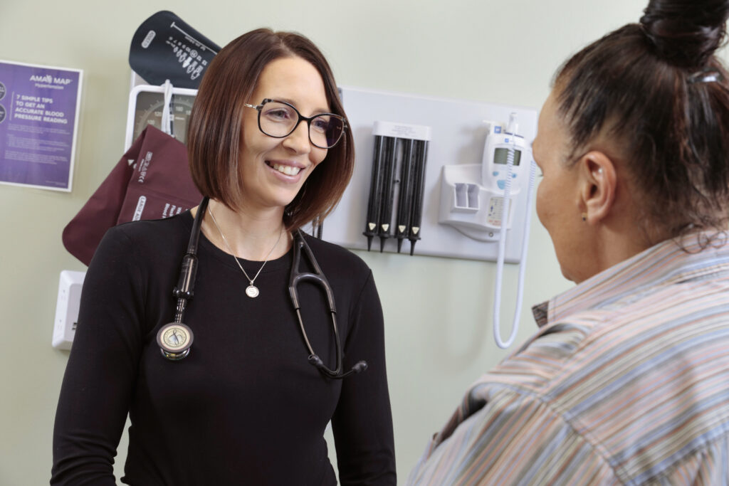 Stephanie Tanona examines a patient