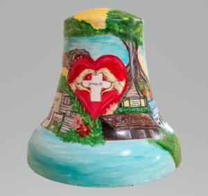 Bright blue hand-painted liberty bell with landmarks of Jermyn