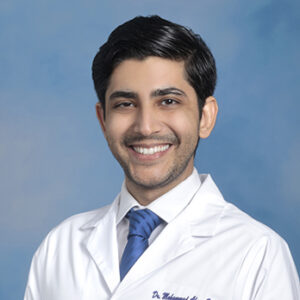 Headshot of resident physician Dr. Mohammad Ahsen Soomro smiling in white coat