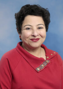 Portrait of Jumee Barooah in red shirt and short dark hair