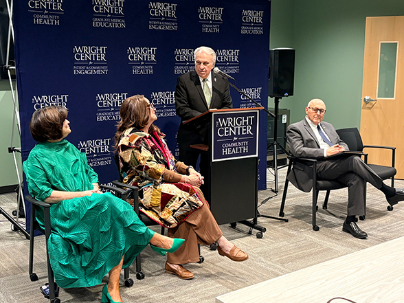 State Representative Eddie Day Pashinski, standing, and Wilkes-Barre Mayor George Brown, seated at right, delivered remarks during the ribbon-cutting ceremony for The Wright Center Pharmacy Wilkes-Barre.