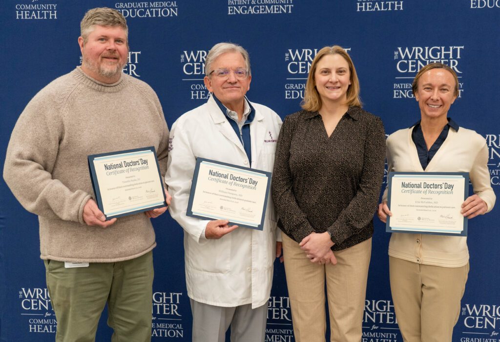 Photo of Wright Center doctors receiving their certificates from Dr. Renee Frank (2nd to last), secretary of PAMED Left to right: Drs. Tim Burke, Bill Dempsey, Renee Frank, Erin McFadden. 