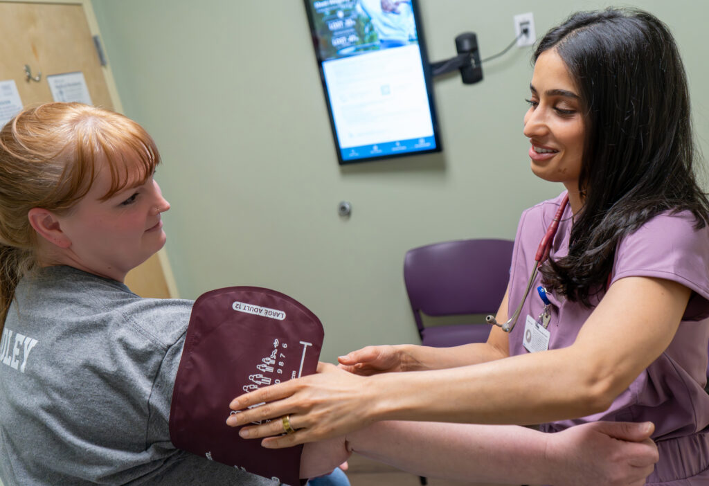 Dr. Pujita “Siri” Mallampalli with a patient
