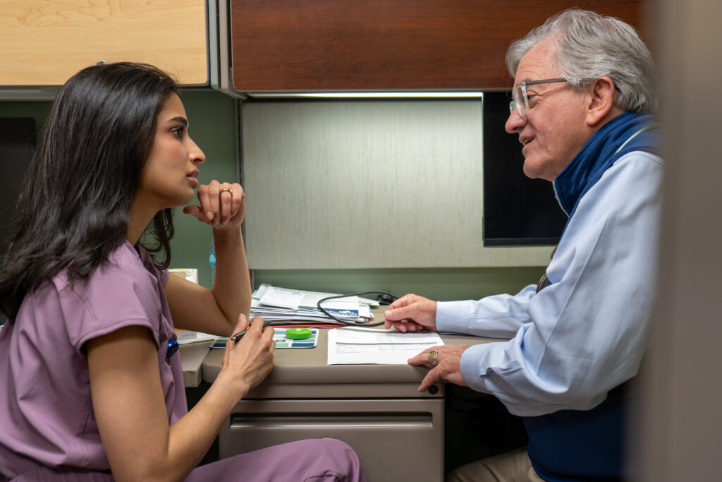 Dr. Pujita “Siri” Mallampalli, a medical assistant at The Wright Center for Community Health Clarks Summit, discusses a case with the community health center’s medical director, Dr. William Dempsey