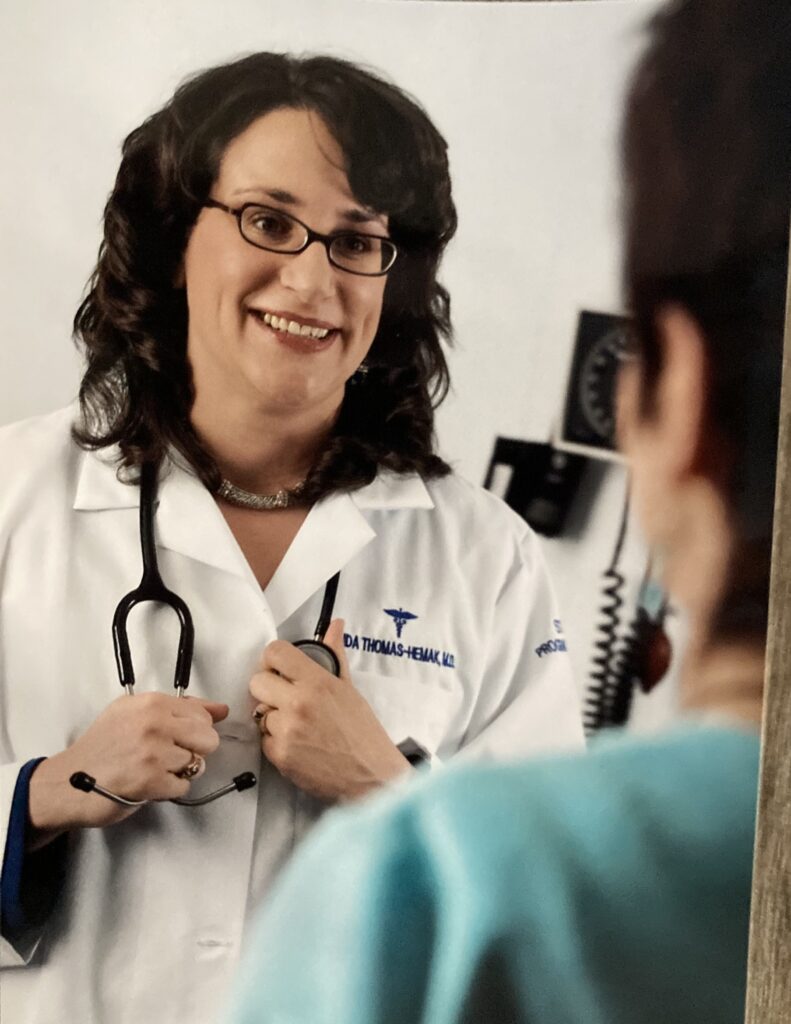Dr. Linda Thomas-Hemak cares for a patient in 2008. 