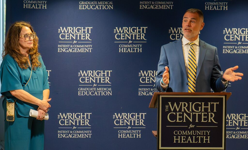 Robert Cole, Ph.D., right, senior vice president and chief analytics officer at Allied Services, gestures to Dr. Linda Thomas-Hemak, president and CEO of The Wright Center, while addressing how the collaboration between The Wright Center for Community Health and Allied Services improves access to care for adult patients in the region.